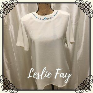 Off white blouse with seashell neckline